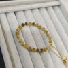 PULSERA CORAZONES DORADA