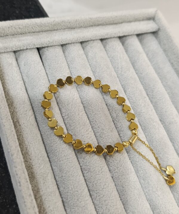 PULSERA CORAZONES DORADA